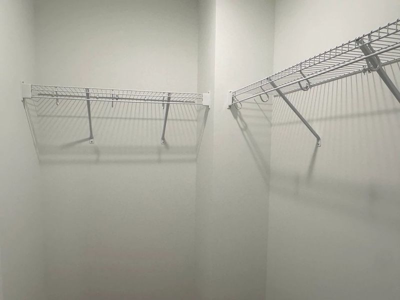 Primary Walk-In - Organized elegance with polished appeal. Primary Walk-In - Organized elegance with polished appeal.