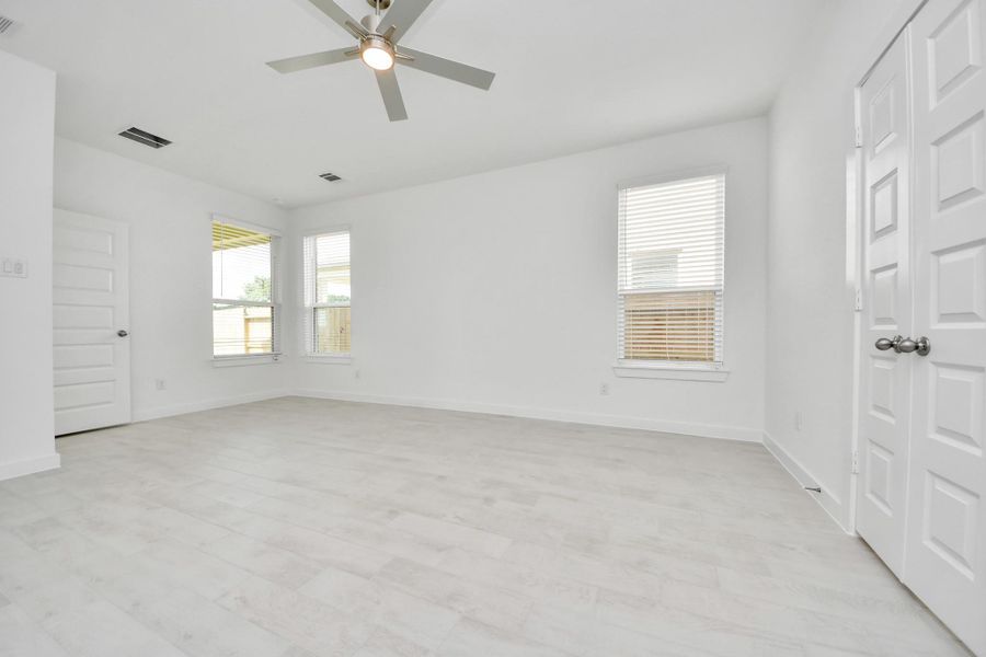 Another perspective unveils a comprehensive view of the serenity and comfort this primary suite offers