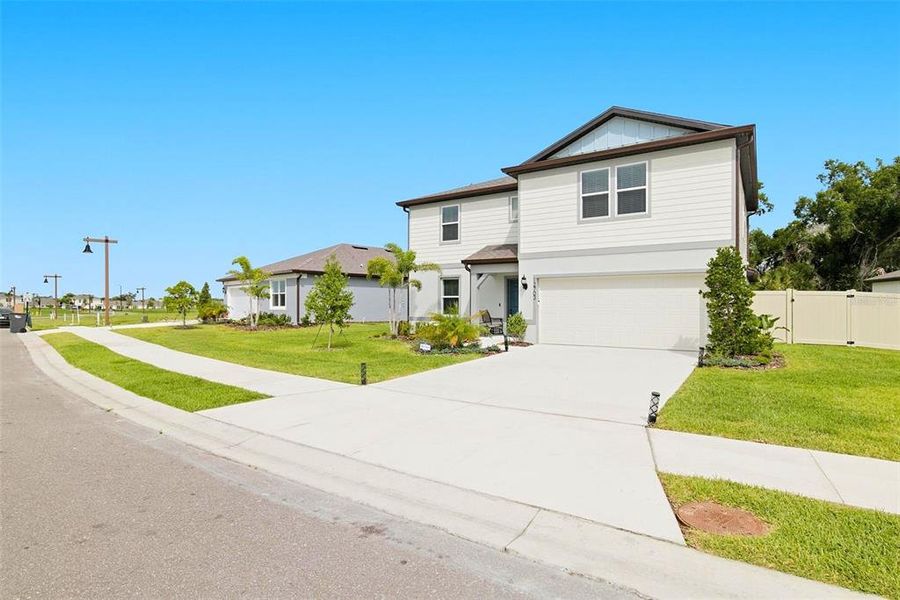 Front exterior of a new home in Oakfield Lakes, Parrish, FL, highlighting curb appeal (Image 22). Front exterior of a new home in Oakfield Lakes, Parrish, FL, highlighting curb appeal (Image 22).