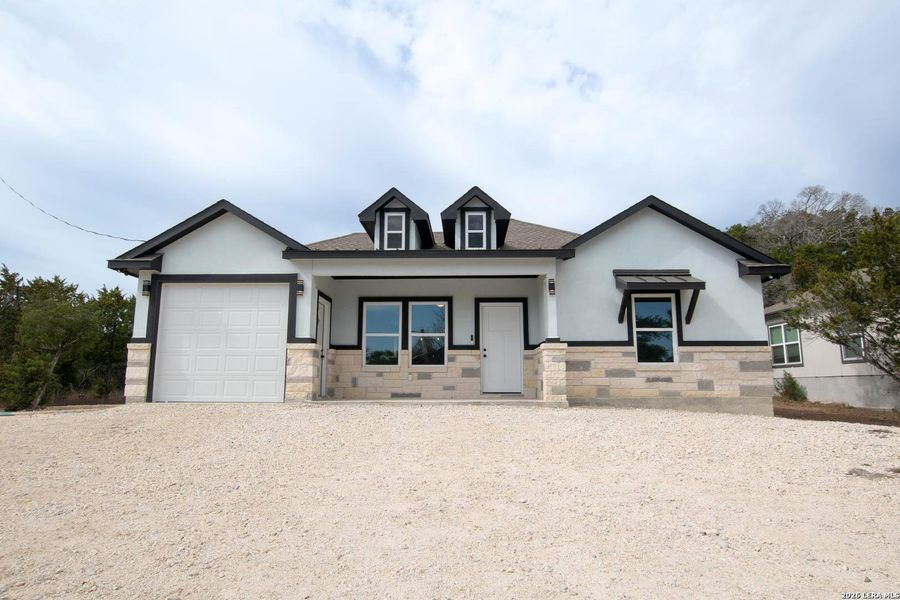 Front exterior of a new home in , Spring Branch, TX, highlighting curb appeal (Image 2). Front exterior of a new home in , Spring Branch, TX, highlighting curb appeal (Image 2).