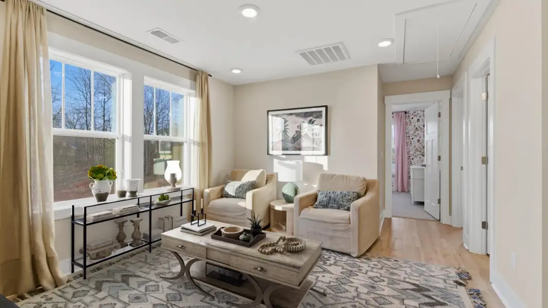 Functional loft with tasteful hardwood floors and exceptional natural light in a modern villa in Greenville, SC