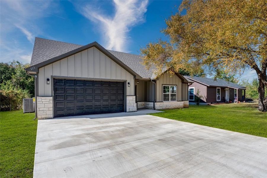 Front exterior of a new home in , Gun Barrel City, TX, highlighting curb appeal (Image 1). Front exterior of a new home in , Gun Barrel City, TX, highlighting curb appeal (Image 1).