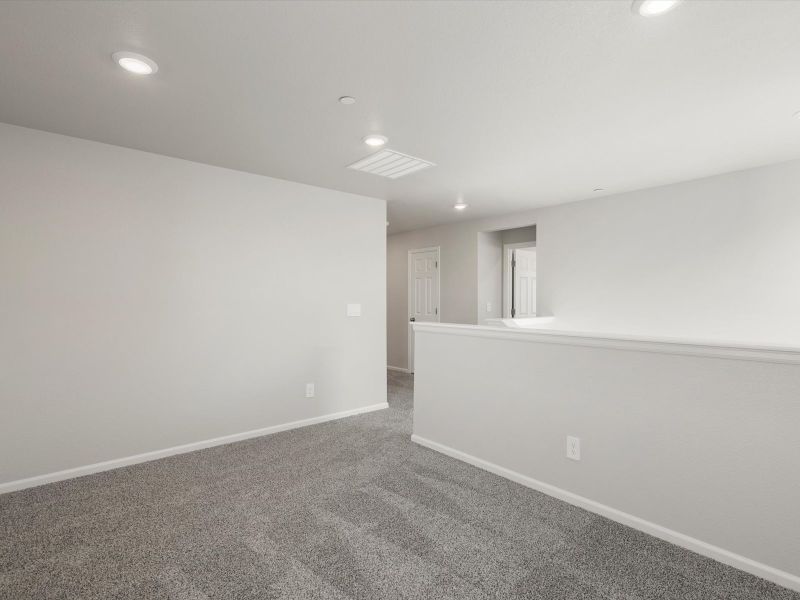 Spacious, unfurnished interior of a new home in Buffalo Highlands: The Flora Collection, Commerce City (Image 11).