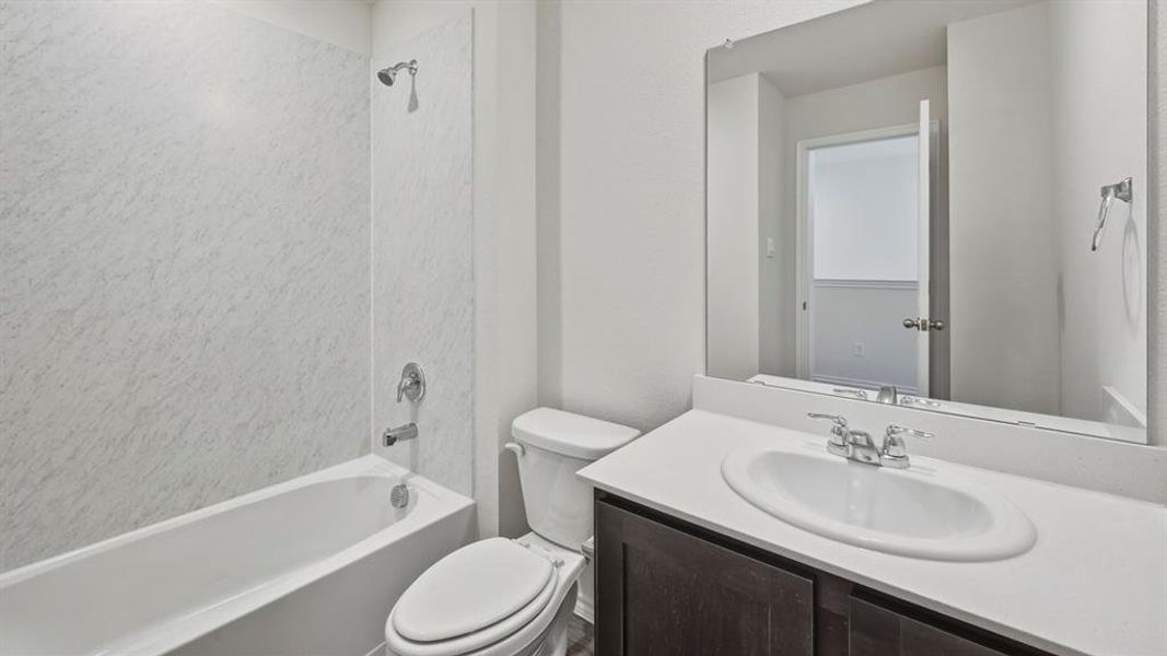 Bathroom with shower / tub combination and vanity