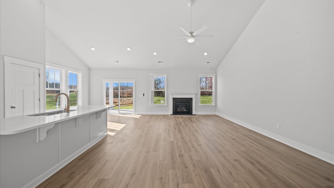 Notable two-story family room offering a grand yet inviting space for memorable everyday living