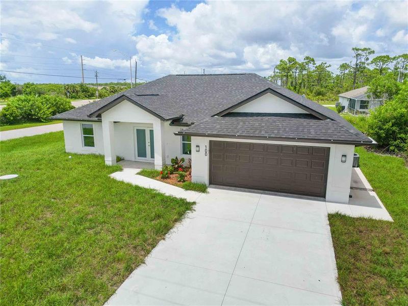 Front exterior of a new home in , Rotonda West, FL, highlighting curb appeal (Image 2).