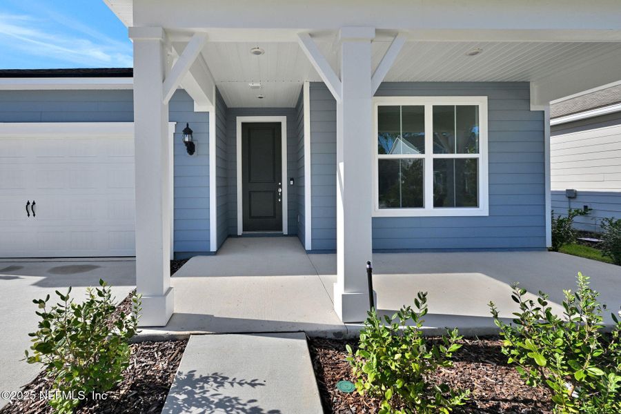 Front exterior of a new home in Hyland Trail, Green Cove Springs, FL, highlighting curb appeal (Image 18). Front exterior of a new home in Hyland Trail, Green Cove Springs, FL, highlighting curb appeal (Image 18).