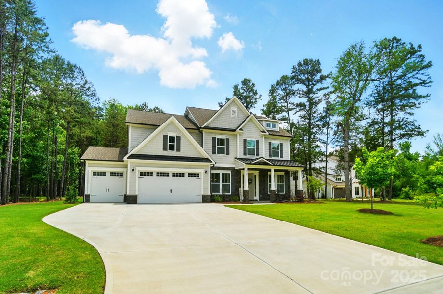 Front exterior of a new home in Fairview Forest, Indian Trail, NC, highlighting curb appeal (Image 1). Front exterior of a new home in Fairview Forest, Indian Trail, NC, highlighting curb appeal (Image 1).
