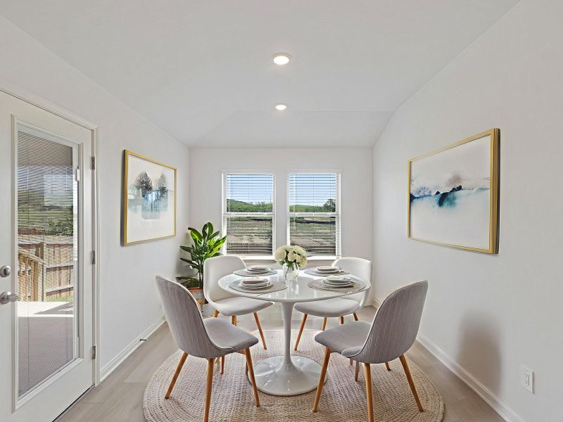 Virtually staged dining room in the Callaghan floorplan at a Meritage Homes community. Virtually staged dining room in the Callaghan floorplan at a Meritage Homes community.