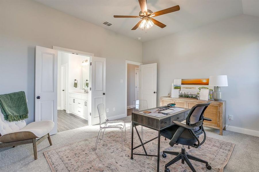 Office space with carpet floors and ceiling fan