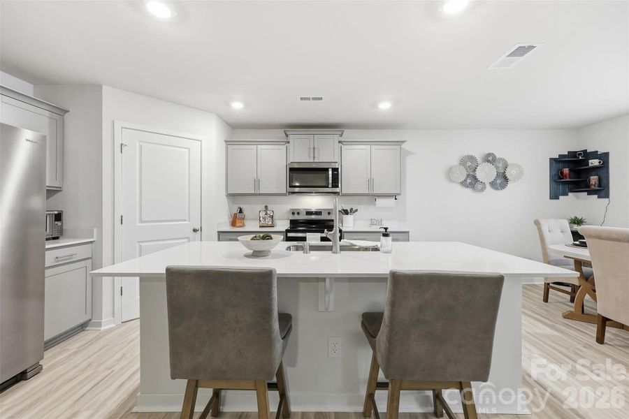 walk in pantry with custom wooden shelving