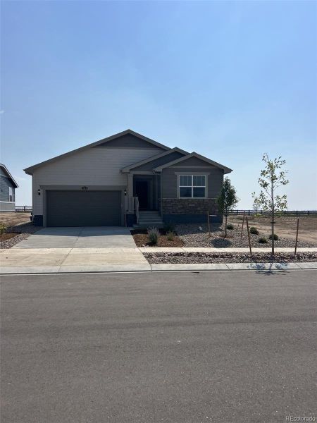 Front exterior of a new home in Percheron: The Camden Collection, Colorado Springs, CO, highlighting curb appeal (Image 1).