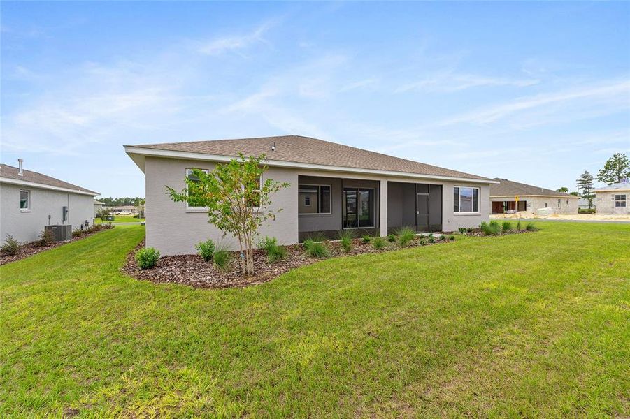 Exterior details and patio area of a home in On Top of the World Communities, Ocala (Image 4).