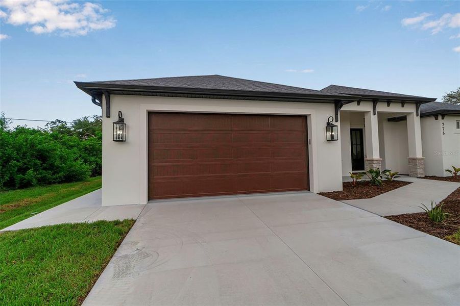 Front exterior of a new home in , Venice, FL, highlighting curb appeal (Image 26).