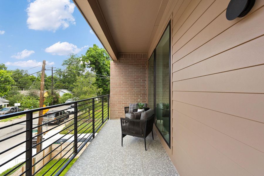 An inviting private patio balcony offers open-air relaxation with a view of the neighborhood. An inviting private patio balcony offers open-air relaxation with a view of the neighborhood.