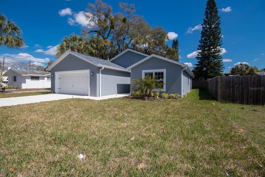 Front exterior of a new home in , New Port Richey, FL, highlighting curb appeal (Image 26).