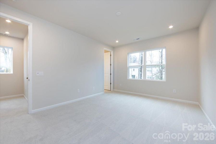 Light filled primary bedroom en suite