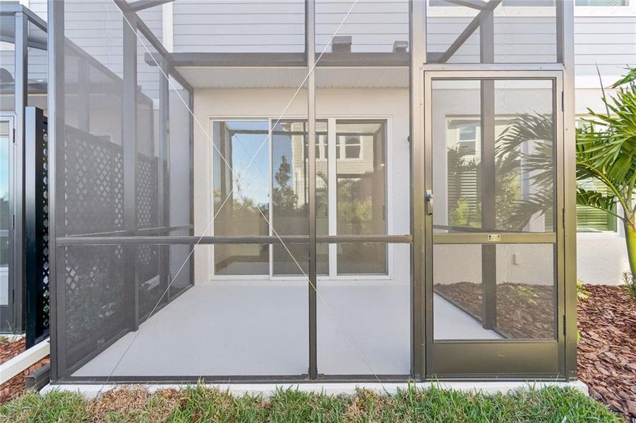 Exterior details and patio area of a home in North River Ranch – Townhomes, Parrish (Image 26).