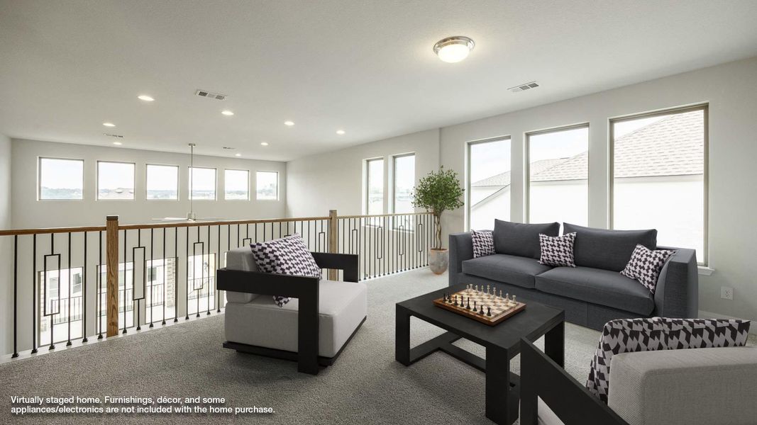 Carpeted living room with recessed lighting