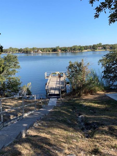 Dock area featuring a water view