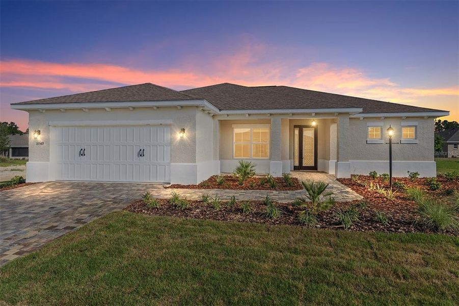 Front exterior of a new home in On Top of the World Communities, Ocala, FL, highlighting curb appeal (Image 15).