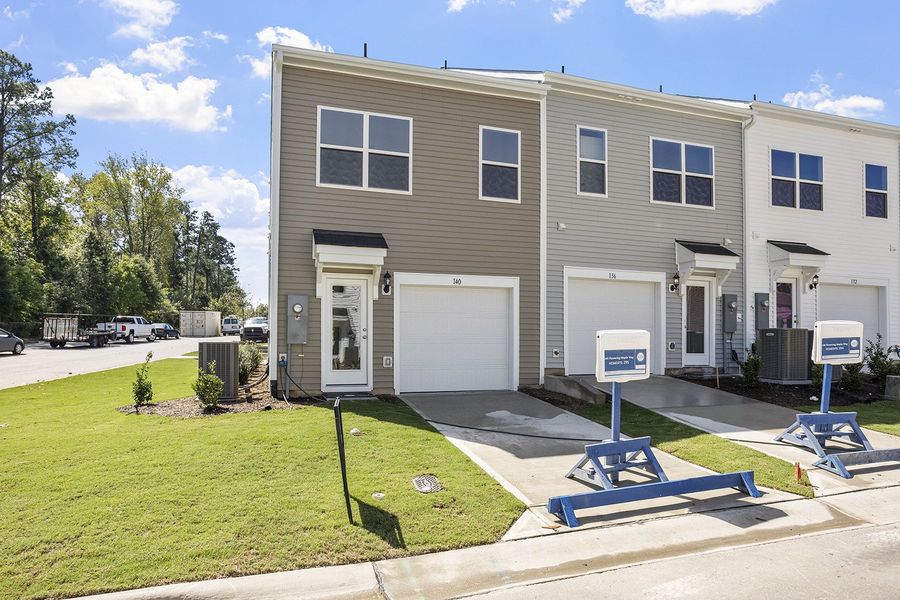 Front exterior of a new home in Renaissance at White Oak, Garner, NC, highlighting curb appeal (Image 2). Front exterior of a new home in Renaissance at White Oak, Garner, NC, highlighting curb appeal (Image 2).