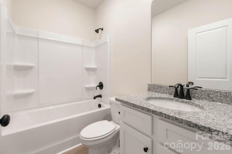 Furnished interior view inside a new home in Stagecoach Station, Gastonia (Image 3).