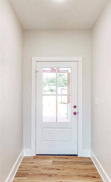 Entryway featuring light wood-style floors Entryway featuring light wood-style floors