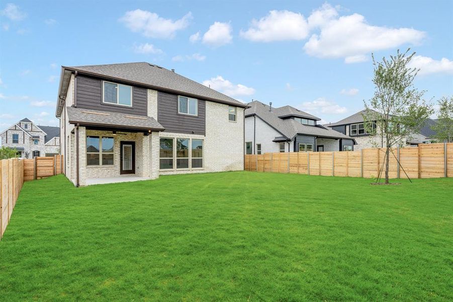 Front exterior of a new home in Painted Tree Woodland District 50, McKinney, TX, highlighting curb appeal (Image 25). Front exterior of a new home in Painted Tree Woodland District 50, McKinney, TX, highlighting curb appeal (Image 25).
