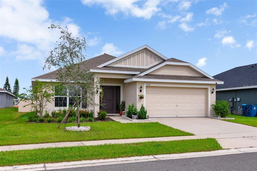 Front exterior of a new home in Citrus Landing, Davenport, FL, highlighting curb appeal (Image 22).