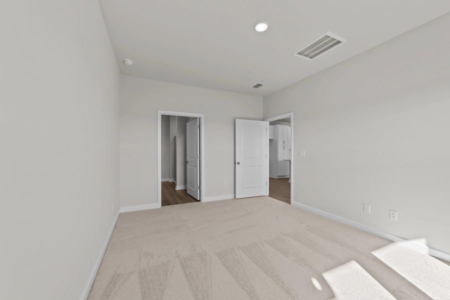 Spacious, unfurnished interior of a new home in Blue Heron Retreat: Villas, Little River (Image 20).