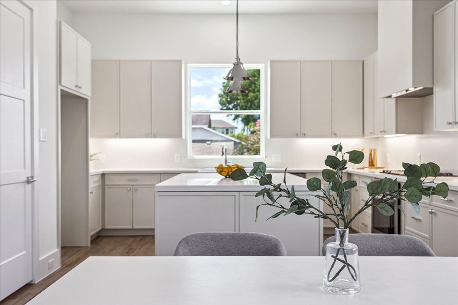 Light-filled kitchen overlooking dining and living.