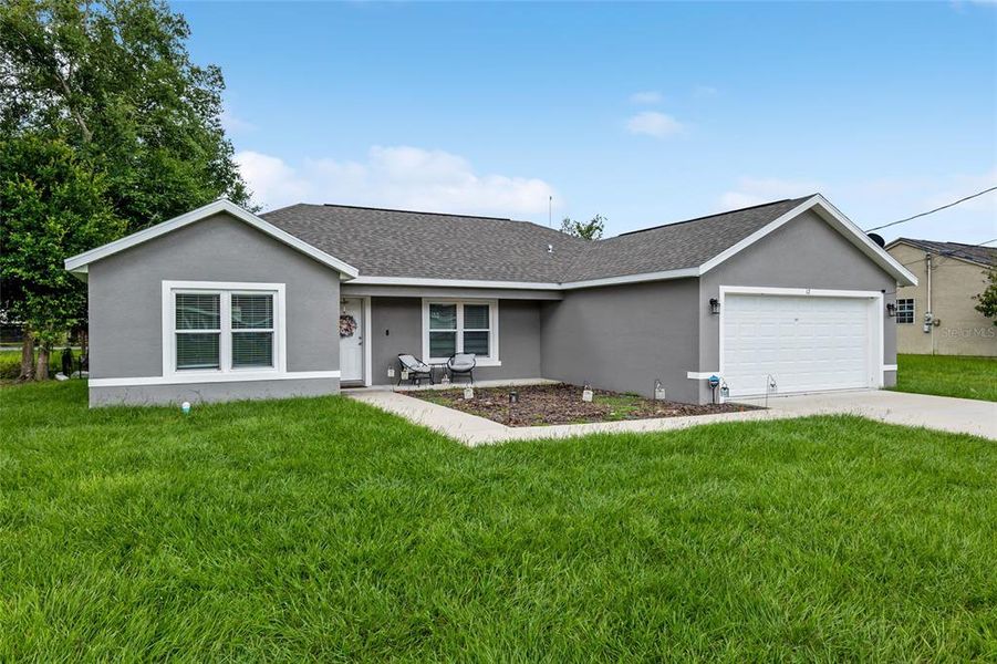 Front exterior of a new home in , Ocala, FL, highlighting curb appeal (Image 27). Front exterior of a new home in , Ocala, FL, highlighting curb appeal (Image 27).