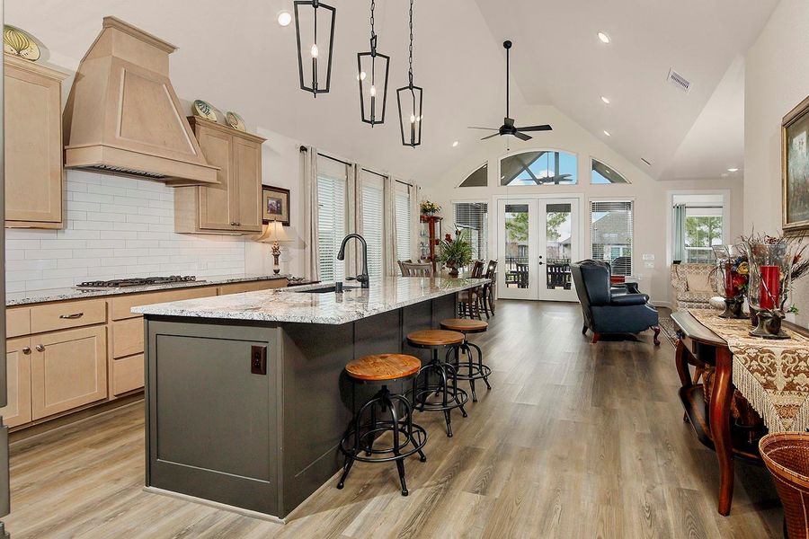 Here comes the volume and charm! The vaulted ceiling adds a wow factor, offering lots of natural light into this main space of the home Here comes the volume and charm! The vaulted ceiling adds a wow factor, offering lots of natural light into this main space of the home