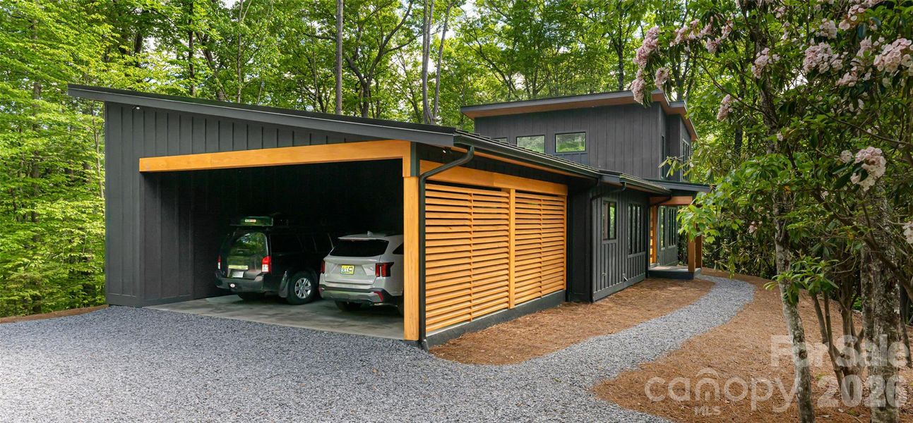 Oversized 2 car carport also houses a storage room