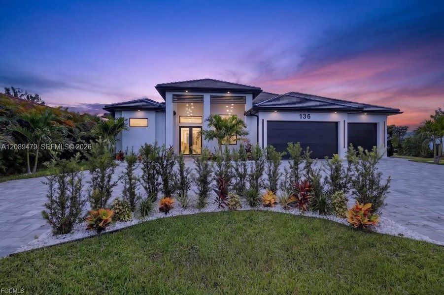 Front exterior of a new home in , Cape Coral, FL, highlighting curb appeal (Image 27). Front exterior of a new home in , Cape Coral, FL, highlighting curb appeal (Image 27).