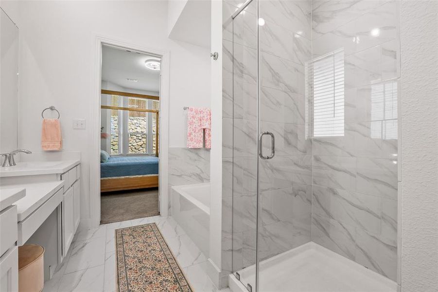 Primary bath is a true spa-like experience with upgraded tile finishes on the tub and shower Primary bath is a true spa-like experience with upgraded tile finishes on the tub and shower