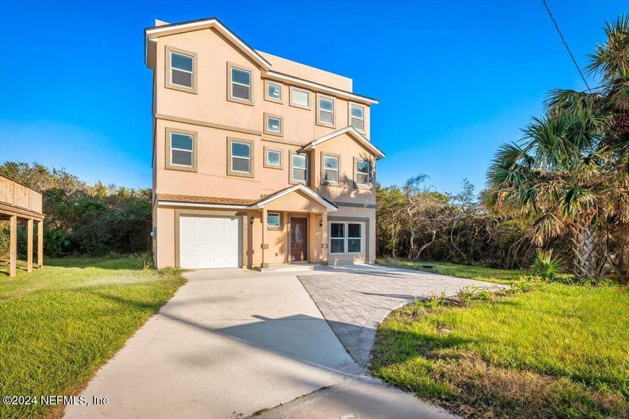Front exterior of a new home in , St. Augustine, FL, highlighting curb appeal (Image 24).