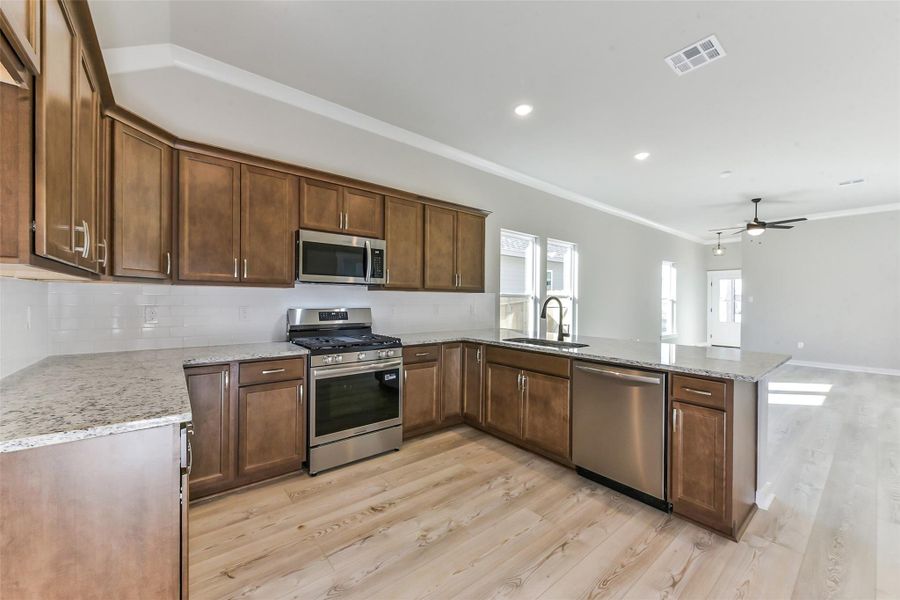 Furnished interior view inside a new home in Aldeana, Bonney (Image 10).