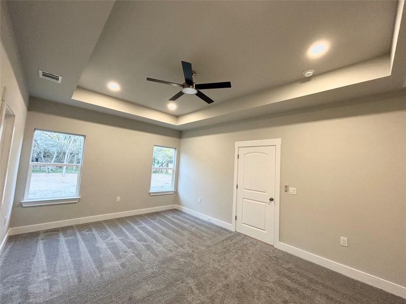 View of backyard from the primary bedroom.