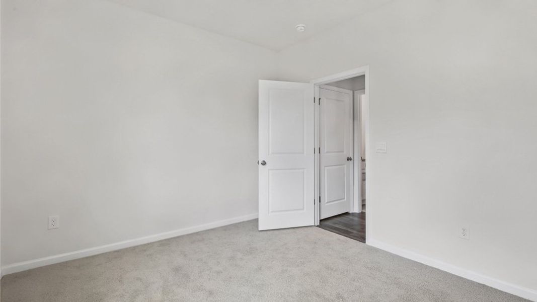 Representative unfurnished interior of a home built from the Robie by D.R. Horton in The Grove at Matthews Landing, Fuquay Varina (Image 17).