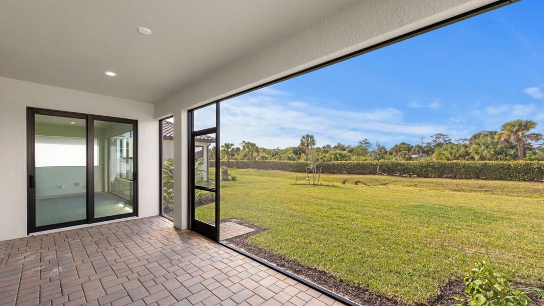 Exterior details and patio area of a home in SkySail, Naples (Image 24).