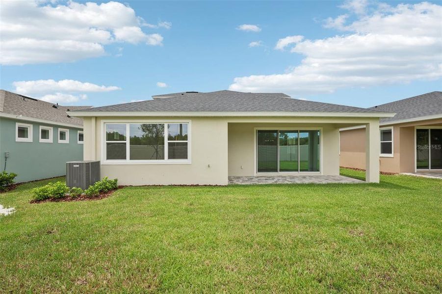 Exterior details and patio area of a home in Primrose at Longleaf, New Port Richey (Image 3).