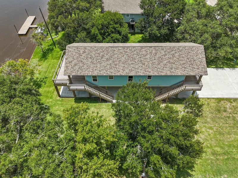 Front exterior of a new home in , Sargent, TX, highlighting curb appeal (Image 24). Front exterior of a new home in , Sargent, TX, highlighting curb appeal (Image 24).
