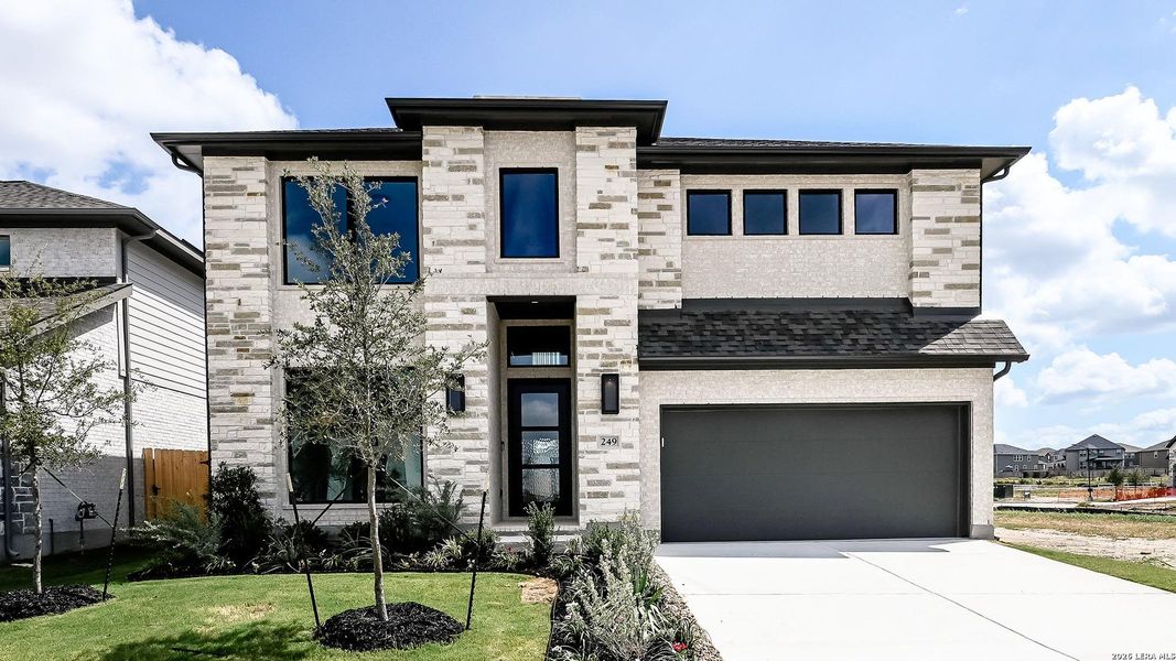 Front exterior of a new home in Legacy at Lake Dunlap, New Braunfels, TX, highlighting curb appeal (Image 21).