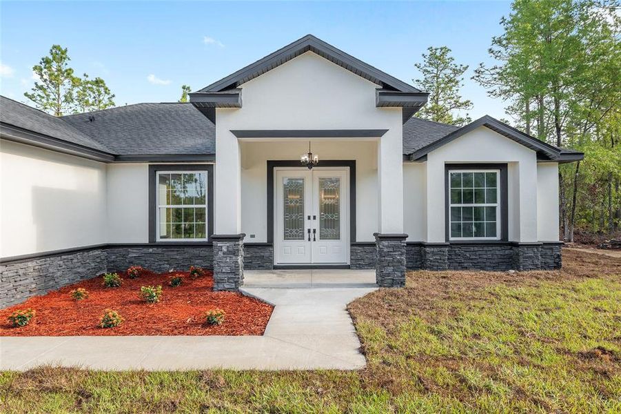 Front exterior of a new home in , Dunnellon, FL, highlighting curb appeal (Image 34).