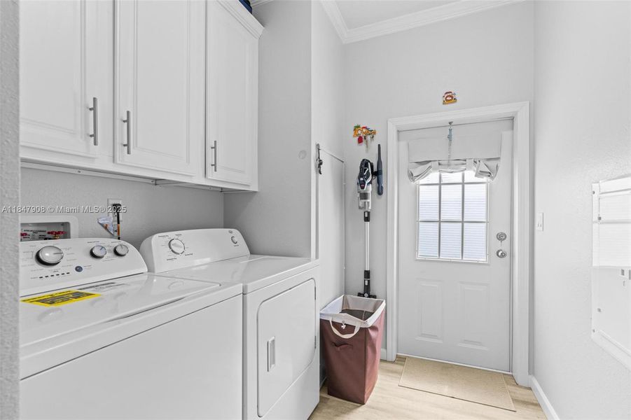 huge laundry room with door to driveway