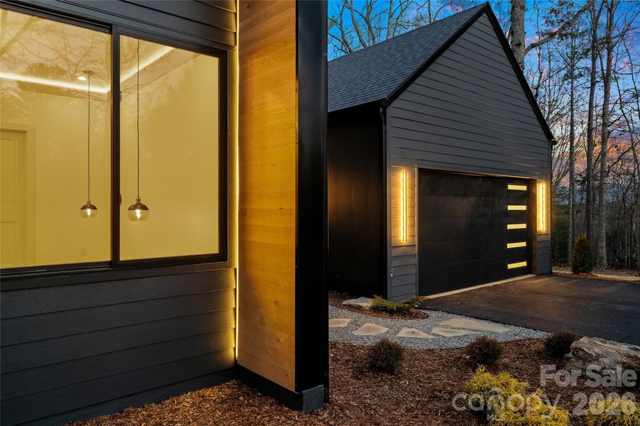 Professionally landscaped grounds with custom hardscaping and native plantings