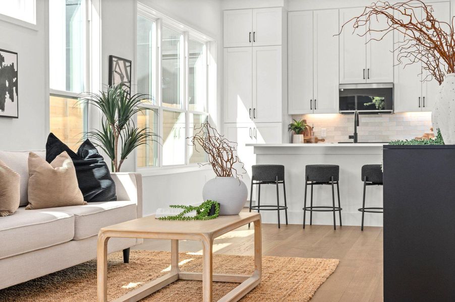 Living room featuring light wood finished floors and plenty of natural light