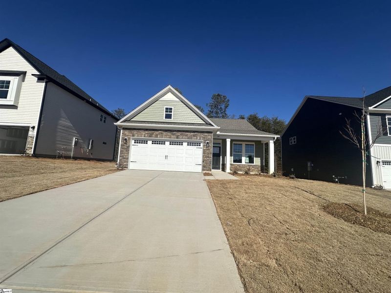 Front exterior of a new home in Shiloh Trail, Wellford, SC, highlighting curb appeal (Image 26).